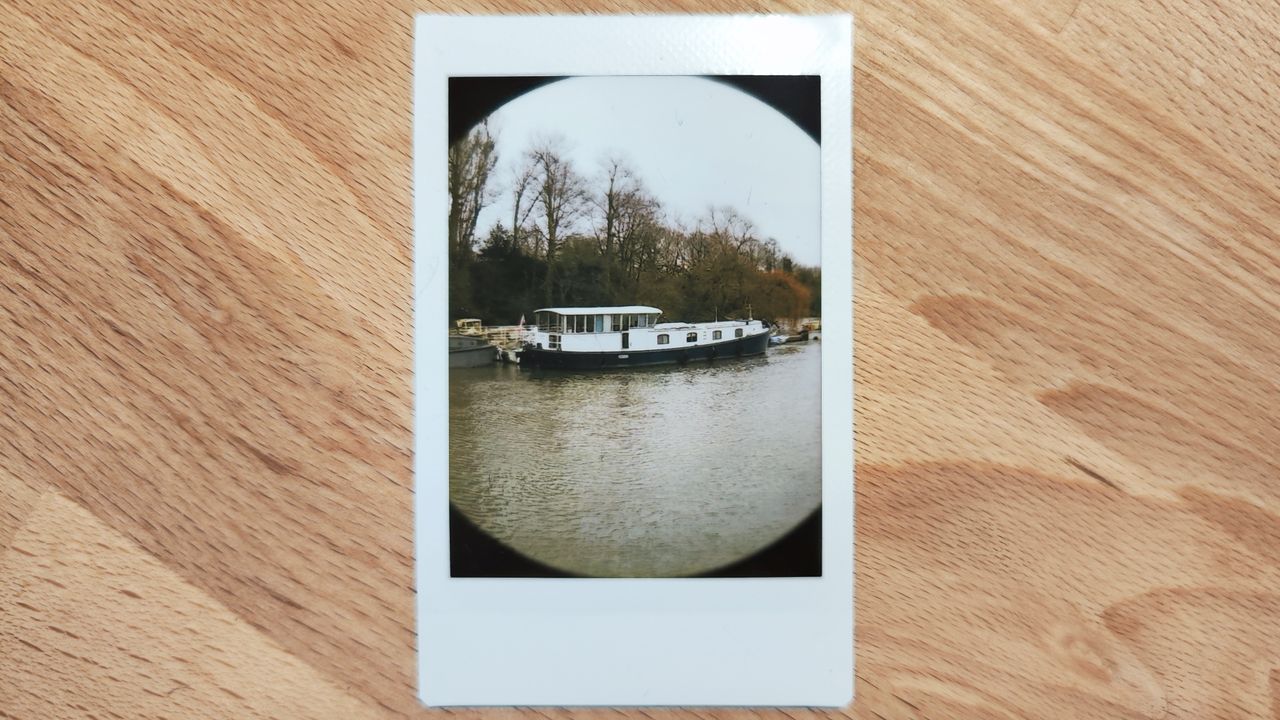 Instant photos on a wooden table
