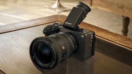 Sony FX5 with lens and EVF on a wooden desk
