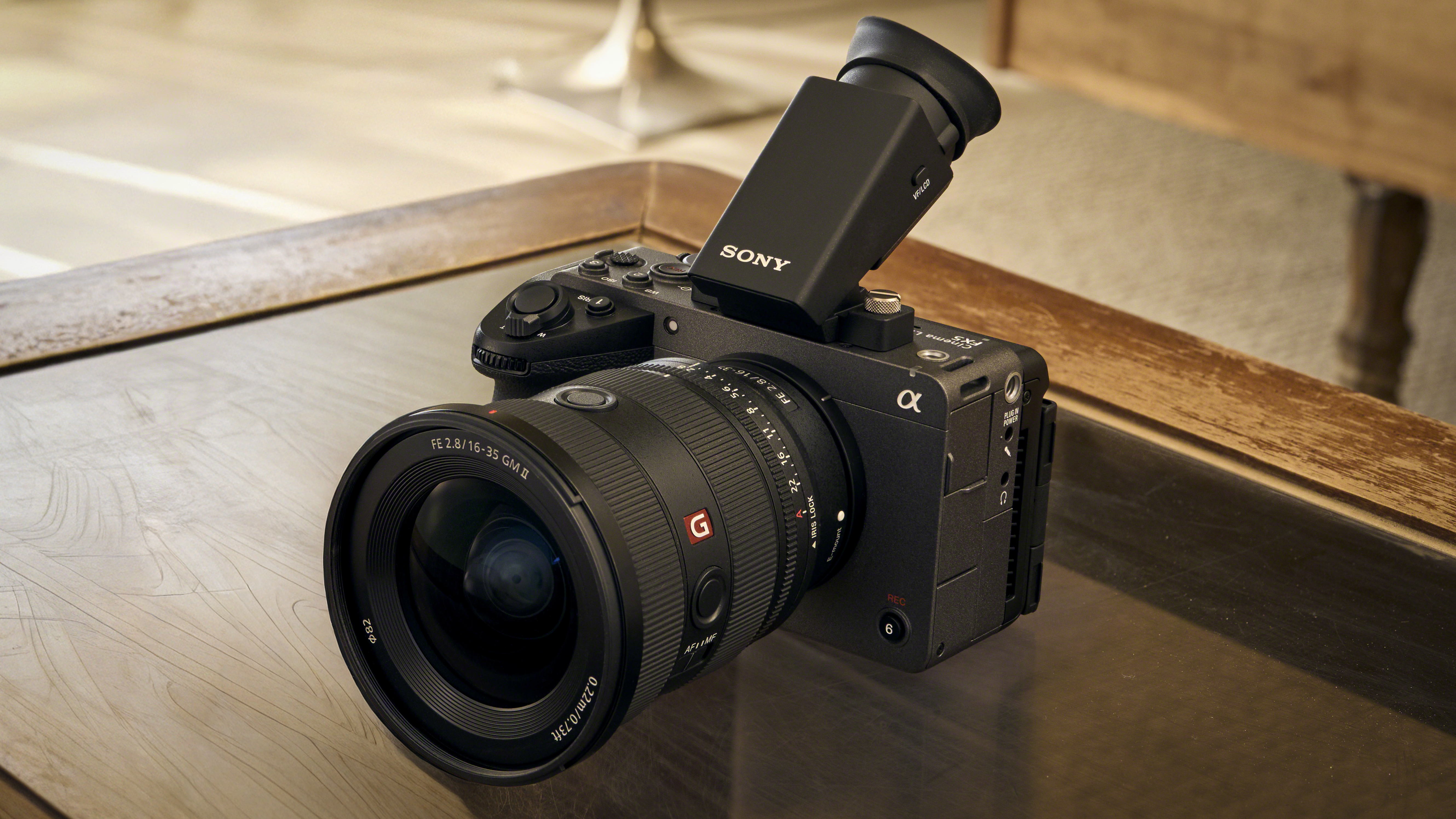 Sony FX5 with lens and EVF on a wooden desk
