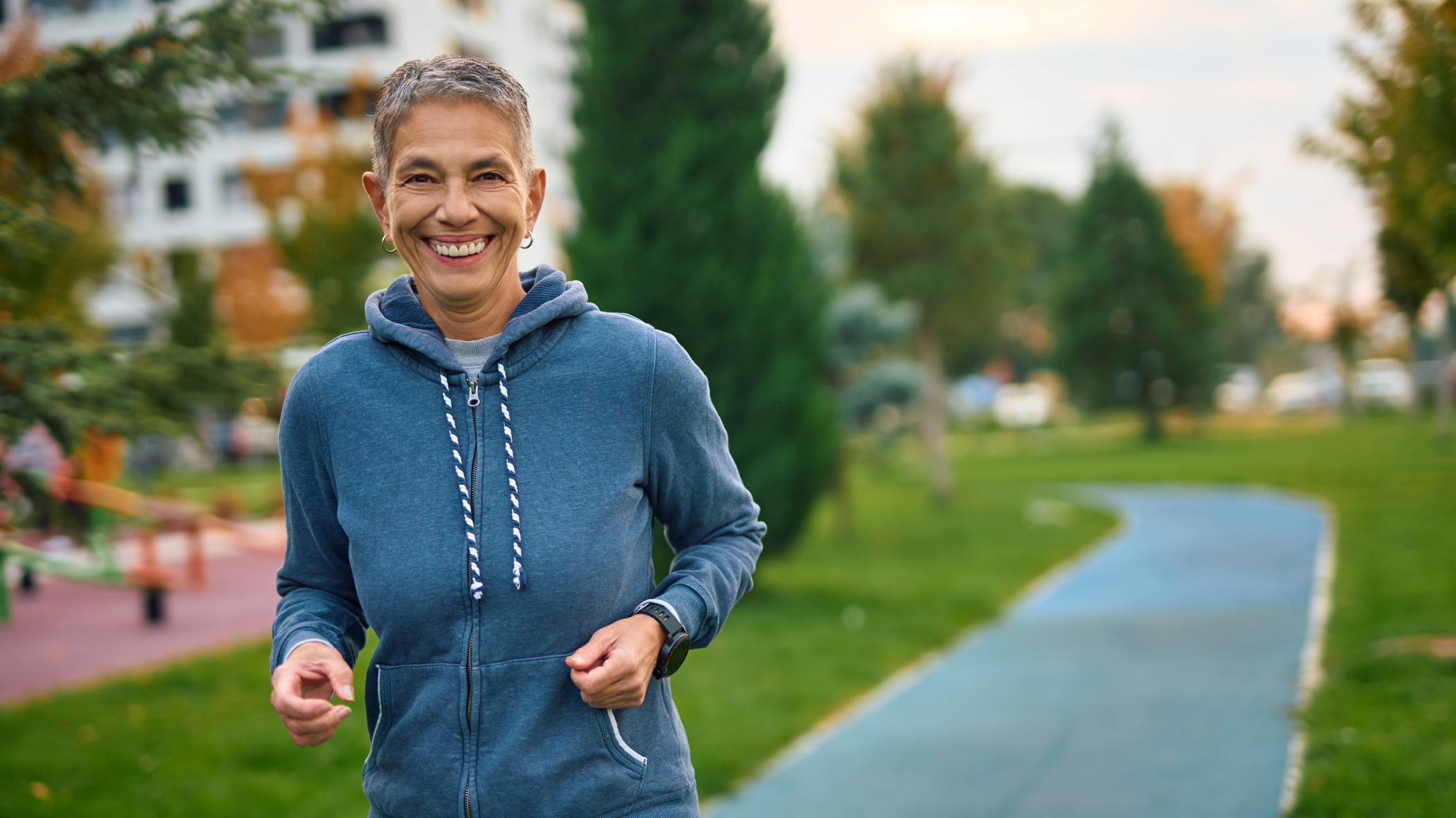 Smiling woman outside in park