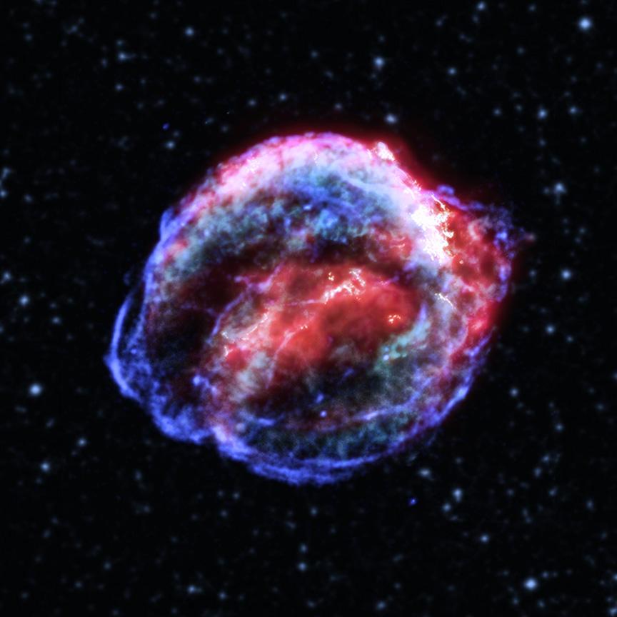 a glowing cloud of blue and red gas against a background of stars.