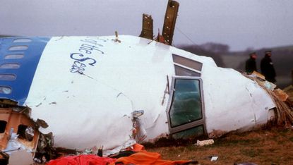 Officials inspect the wreckage of Pan Am Flight 103