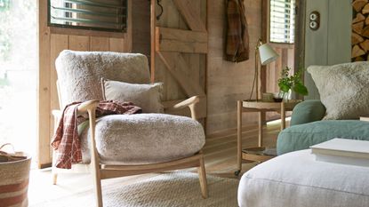 living room with green painted wood panelling and fireplace