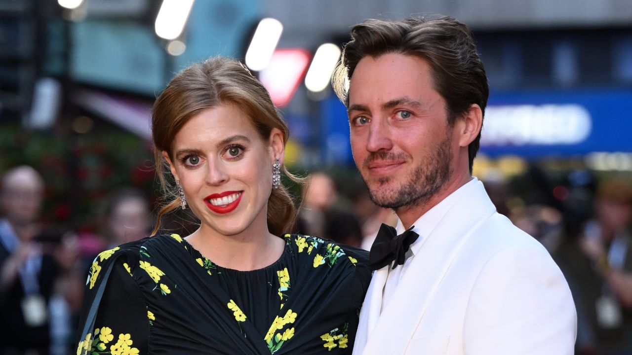 Princess Beatrice wears a black dress featuring yellow flowers and has red lipstick on, while her husband Edoardo Mapelli Mozzi wears a white tuxedo