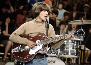 George Harrison (playing a Gretsch 6119 Tennessean guitar with Bigsby vibrato) performs on stage during rehearsals for the Beatles appearance on the ABC Television music television show 'Thank Your Lucky Stars' at Alpha Television Studios in Aston, Birmingham on 28th March 1965. The band would go on to play three songs on the show, Eight Days A Week, Yes It Is and Ticket To Ride.