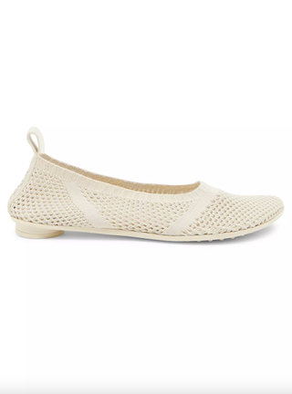 a pair of mesh flats by Bottega Veneta in front of a plain backdrop