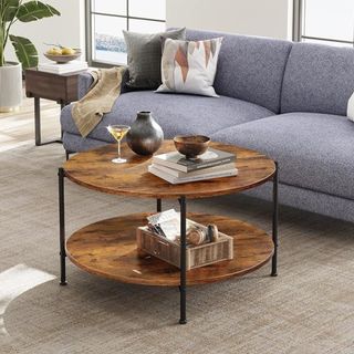 A circular, two-tiered wood coffee table