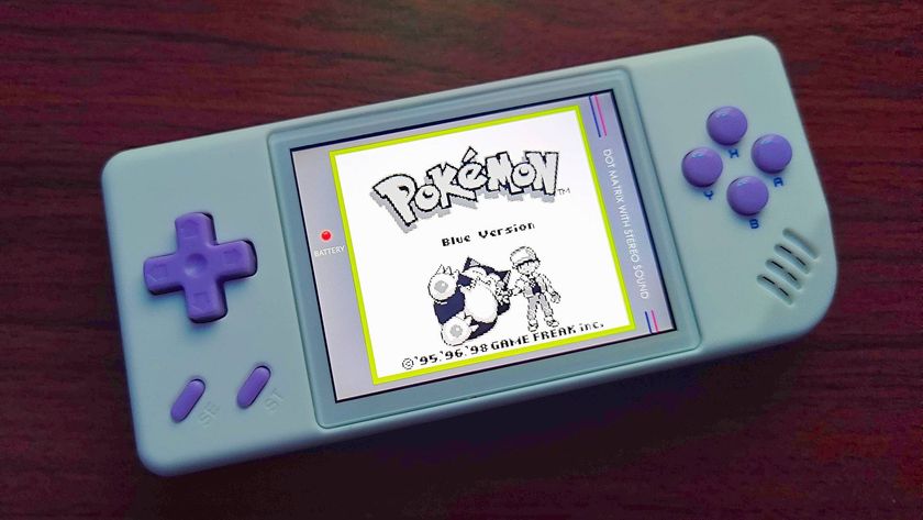 Anbernic RG28XX handheld with Pokemon Blue title screen on display with Game Boy-themed overlay