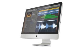 A desktop Mac with Garageband on the screen