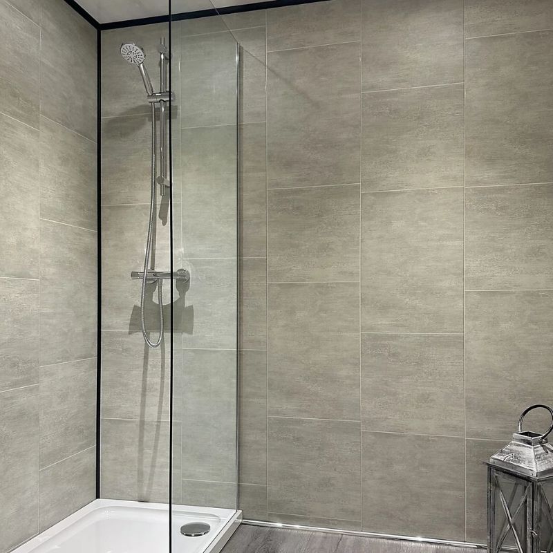 A bathroom with large format wall tile effect panels 