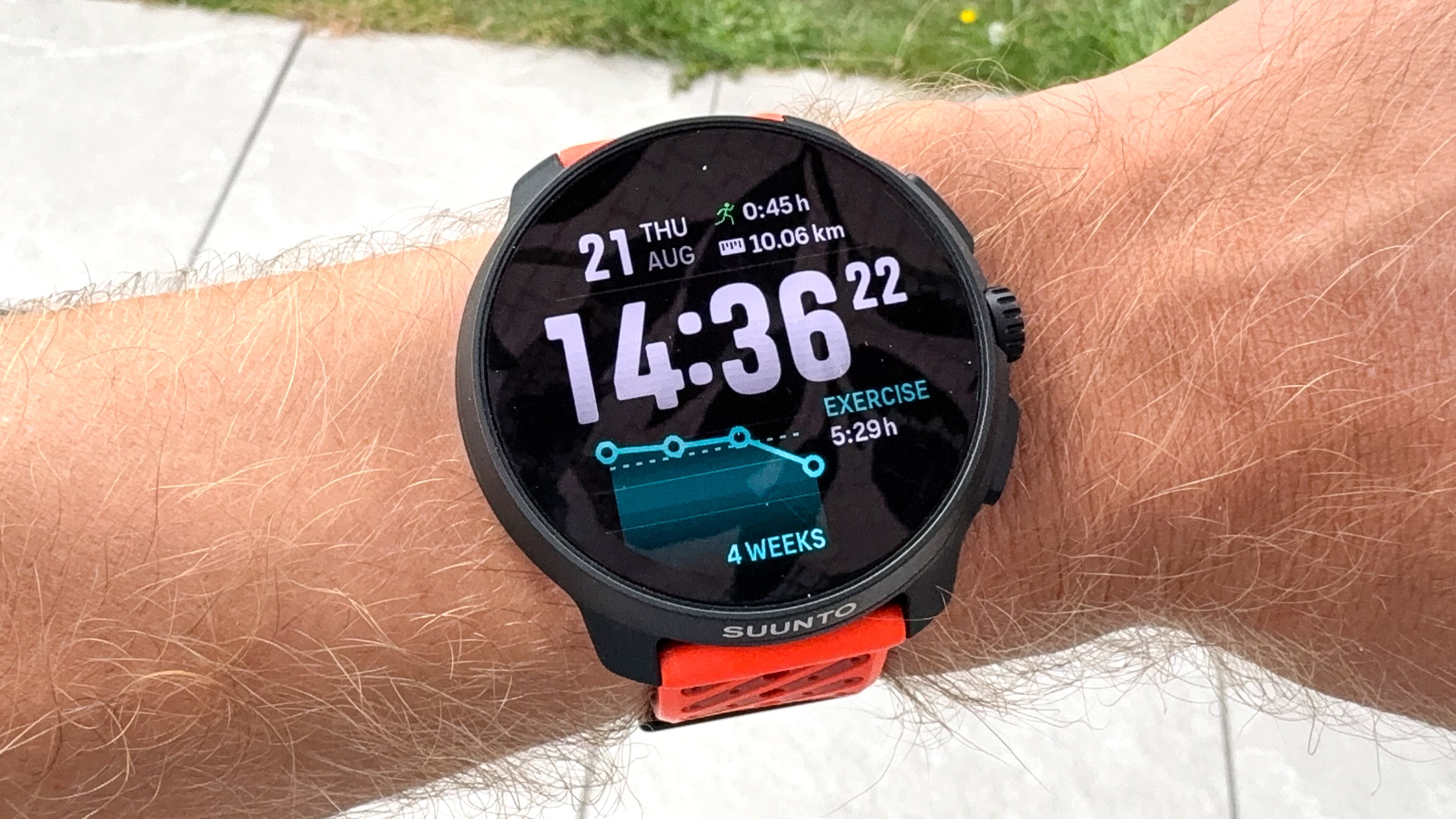 Suunto Race 2 on a person&#039;s wrist showing a run analysis