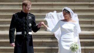 Prince Harry, Duke of Sussex and the Duchess of Sussex depart after their wedding ceremony at St George's Chapel