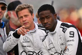 JULY 09: Brad Pitt, star of the upcoming Formula One based movie, Apex, and Damson Idris, co-star of the upcoming Formula One based movie, Apex, look on from the grid during the F1 Grand Prix of Great Britain at Silverstone Circuit on July 09, 2023 in Northampton, England.