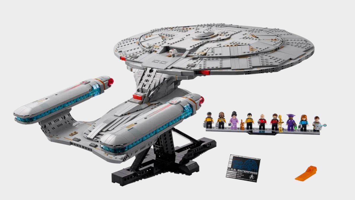Lego Enterprise and minifigures on stands, against a plain background