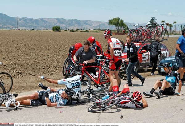 Alex Dowsett (far right) and others come down at the Tour of California
