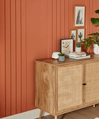 Wall paneled wall decor painted with orange paint
