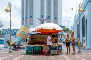A fruit seller outside of the Central Market in Kuala Lumpur