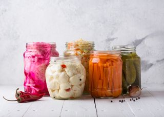 Probiotics for women: Fermented vegetables. Sauerkraut with carrots and cucumbers.