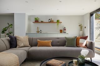 grey sofa with coloured cushions