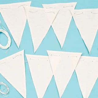 Plain white bunting flags on blue background