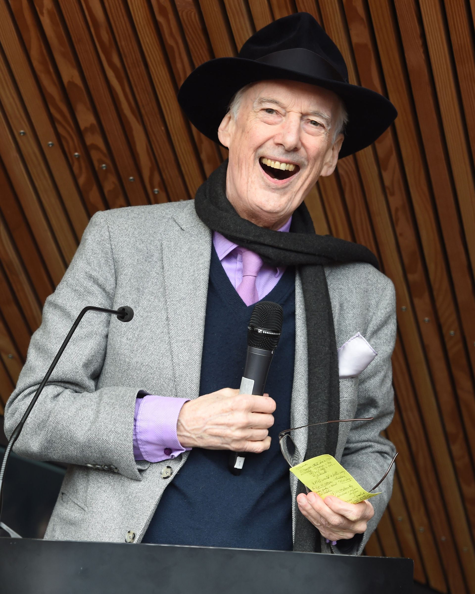 Charles Jencks laughing with a microphone in his hand