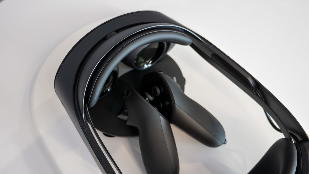 Meta Quest Pro headset with Quest Touch Pro controllers charging on the included dock