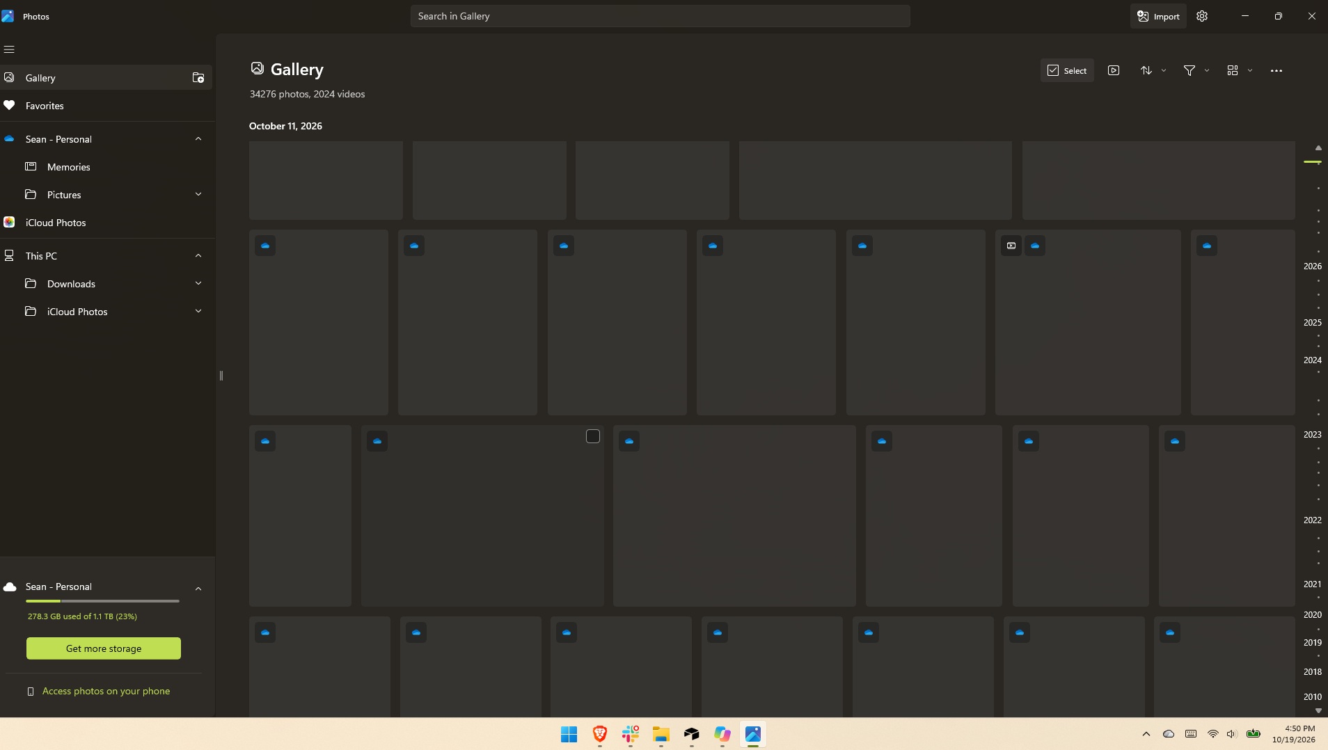 Microsoft Photos displaying a Gallery view filled with blank thumbnail placeholders as images fail to load quickly.