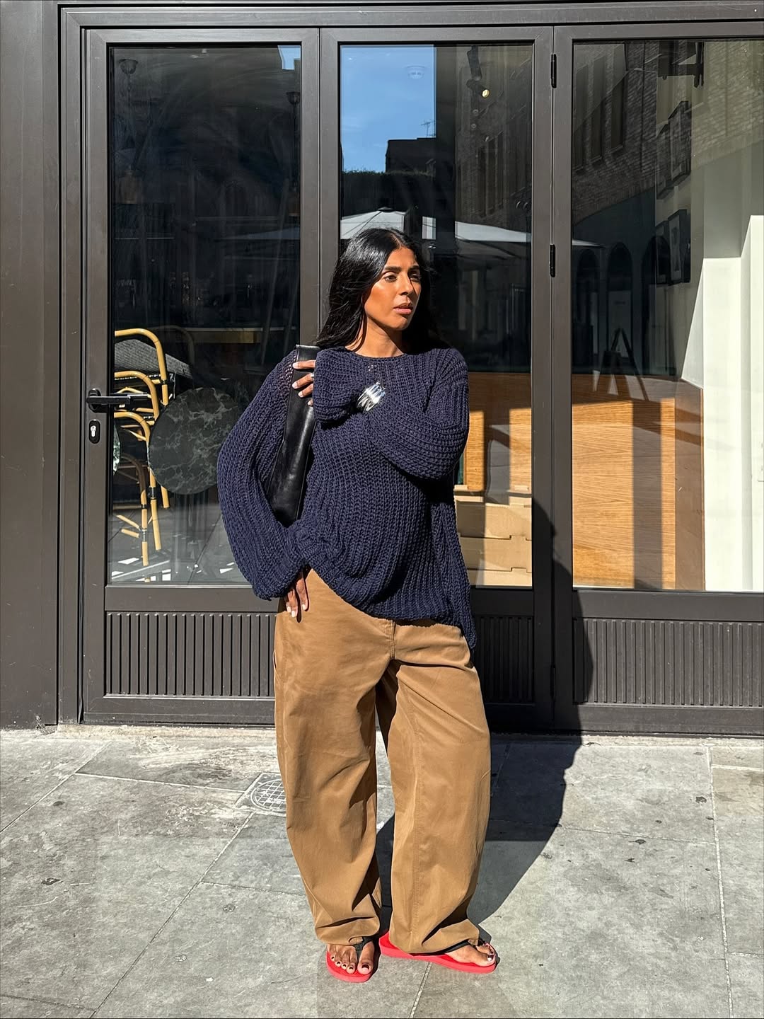 @monikh wearing navy jumper