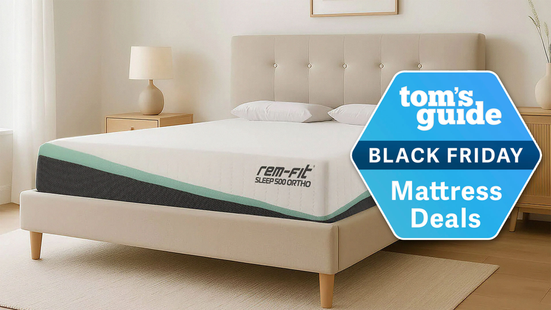 REM-Fit 500 Ortho Hybrid Mattress in a bedroom with a Tom's Guide Black Friday Mattress Deals badge overlaid