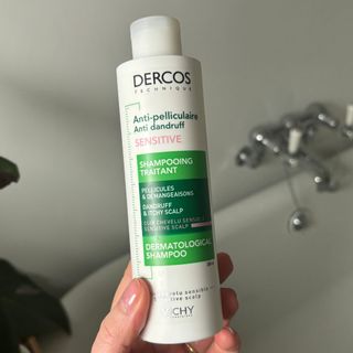 Laura holding Vichy Dercos Technique Anti-Dandruff Purifying Shampoo