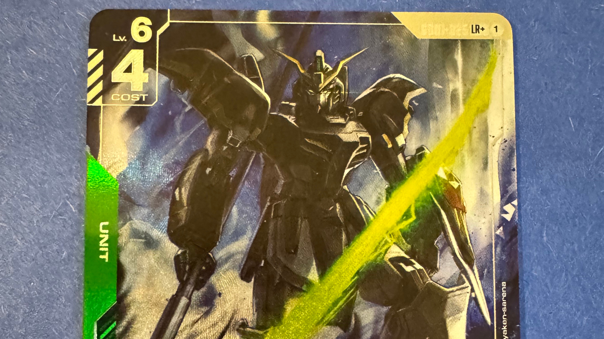 A Gundam on a card staring into the foreground, with numbers and text on the edges
