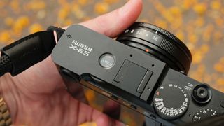 Fujifilm X-E5 camera with 23mm lens attached held in a hand
