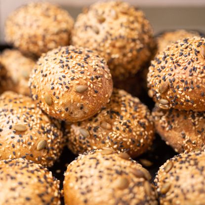 sesame seeds covering small round buns