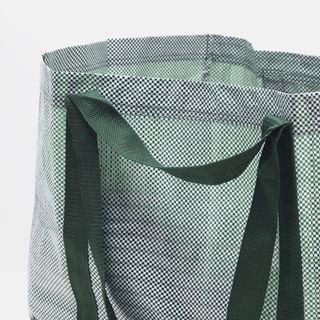 carry bag in dotted designed and dark green handle