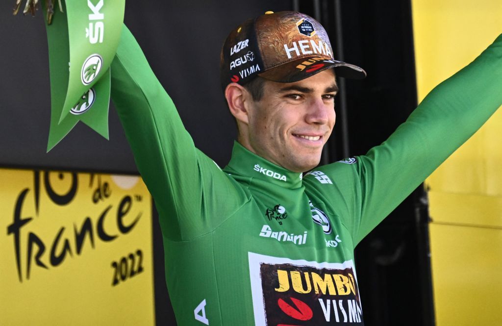 Stage winner JumboVisma teams Belgian rider Wout Van Aert wearing his sprinters green jersey celebrates on the podium after the 8th stage of the 109th edition of the Tour de France cycling race 1863 km between Dole in eastern France and Lausanne in Switzerland on July 9 2022 Photo by AnneChristine POUJOULAT AFP Photo by ANNECHRISTINE POUJOULATAFP via Getty Images