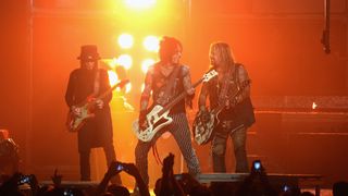 (from left) Mick Mars, Nikki Sixx and Vince Neil of Mötley Crüe perform at at Madison Square Garden on October 28, 2014 in New York City