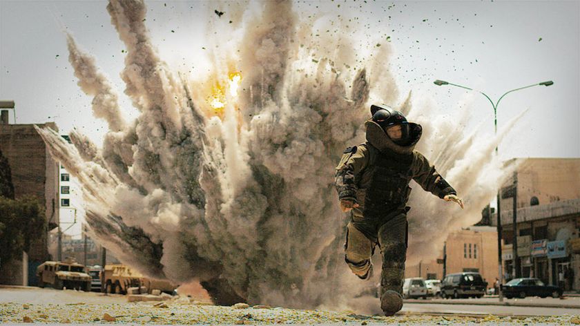 Jeremy Renner running from a bomb explosion in The Hurt Locker