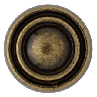 A brass circular door handle