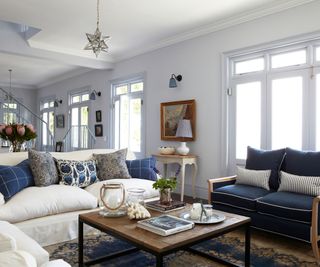 Blue sofa, white sofa, wooden coffee table