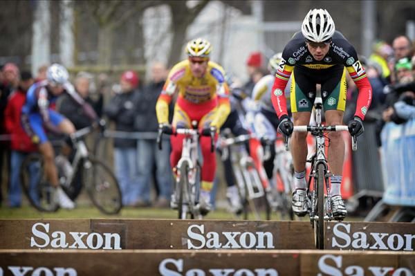 Sven Nys bunnyhops a section of barriers.