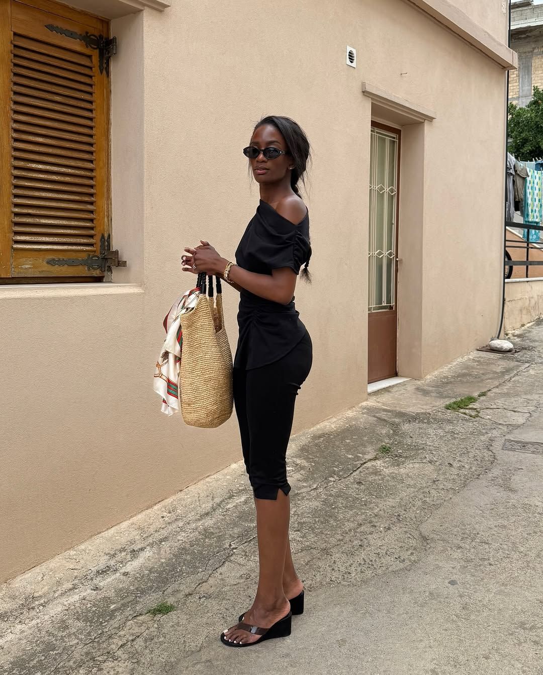 liv madeline wears a black top, black capri trousers and thong wedges: best bottoms to wear with flip flop heels 2026