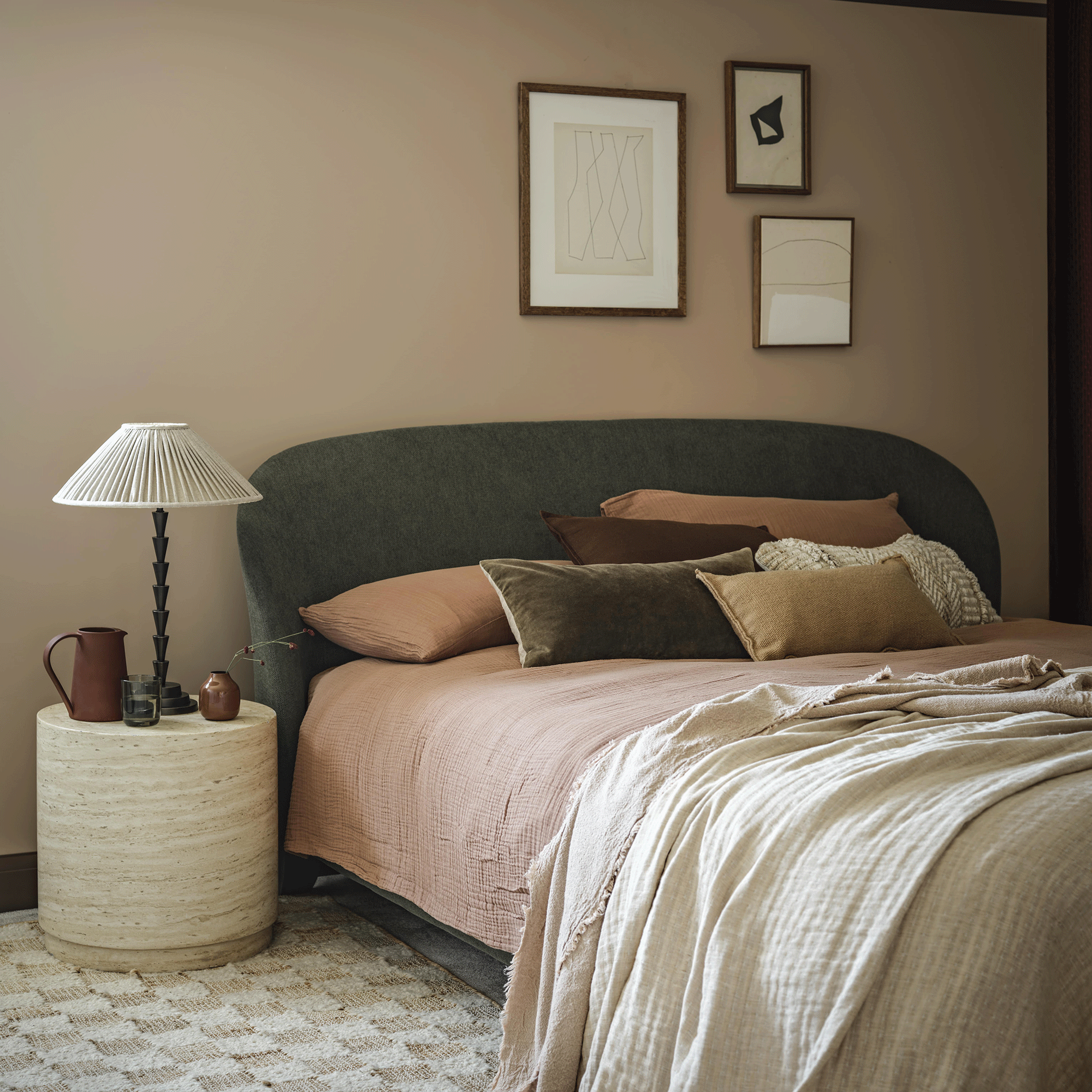 Pooky edgar lamp on bedside table with green upholstered bed
