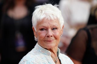 British actress Judi Dench poses for a photograph upon arrival for the UK premiere of "Victoria & Abdul" in London on September 5, 2017