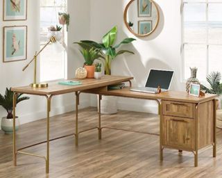 A bright home office with a decorated wooden desk