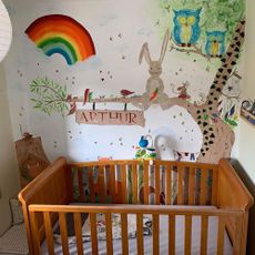 painted nursery wall with cradle