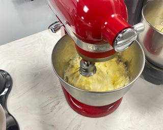 Image of KitchenAid Artisan Mini Stand mixer during whipped cream test