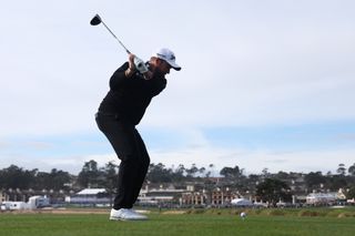 Shane Lowry tees off the 18th hole