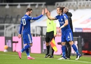 Leicester City’s James Maddison (left) is congratulated by team-mate Caglar Soyuncu during a substitution in the Premier League match at St James’ Park, Newcastle