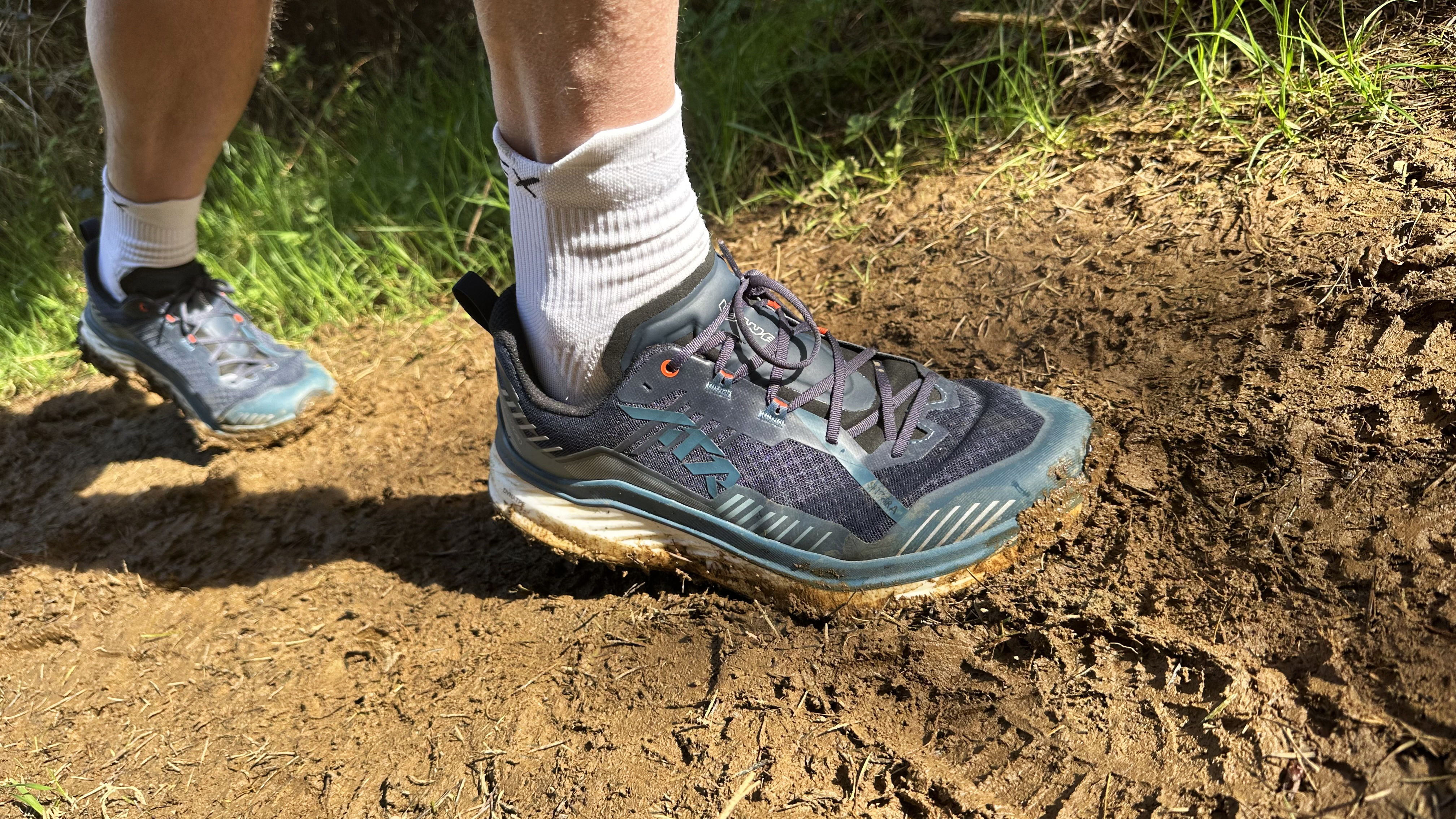 Runner going through mud wearing the Lowa Skyterras