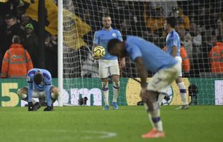 Manchester City players dejected at Wolves